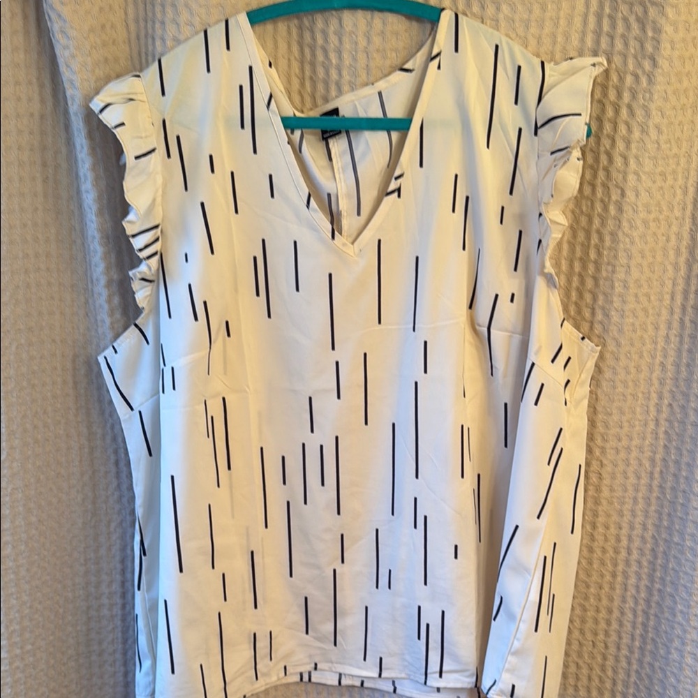 White and Black Ruffled Sleeveless Blouse